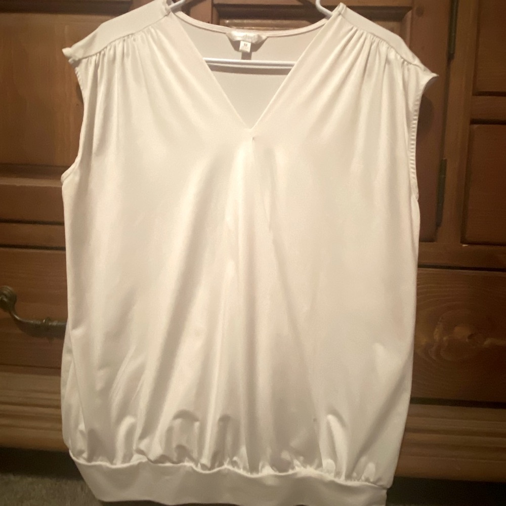 White Sleeveless top.